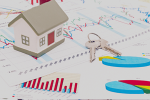 Housing market concept image with graph and toy house